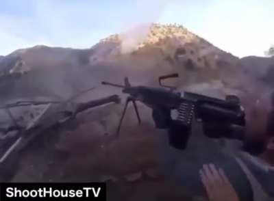 U.S. Soldier trys to get his Afghan National Army Comrade to employ his M249 on their enemies, but eventually just ends up taking it