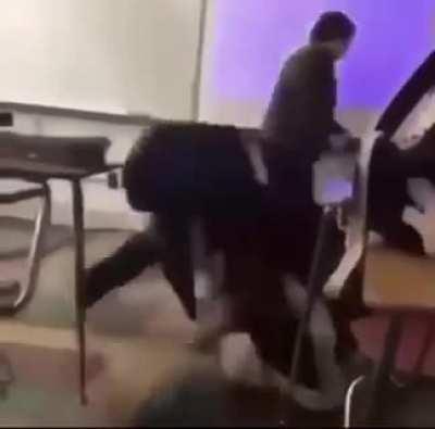 Kid gets sucker punched and still kicks ass