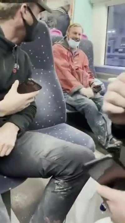 Man tired after work forgot to plug in his headphones