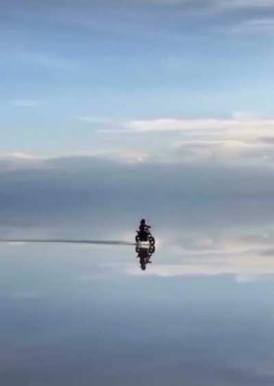 Salar De Uyuni is the world’s largest salt flat, following rain a thin layer of calm water transforms the flat into the world largest mirror 80 miles across.