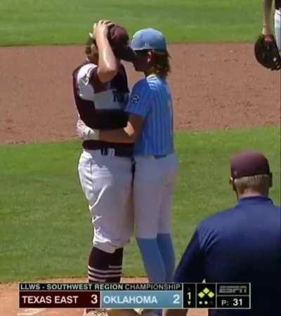 Kid gets hit in the head by baseball and instead of getting angry, he goes and comforts the distraught pitcher and let's him know it's okay