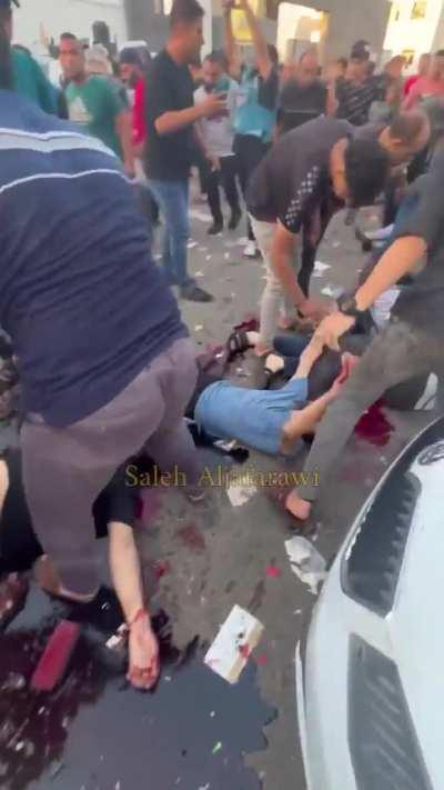 Video from aftermath of attack on ambulance convoy leaving Al-Shifa Hospital towards Rafah Crossing. NSFW