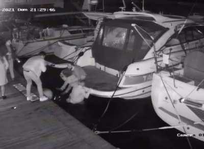 Guy steps on a ball fender