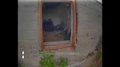 Brief clip of Russian soldiers in a house attacked by a Ukrainian FPV drone