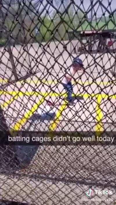 Dumbass kid walks in front of automatic pitcher