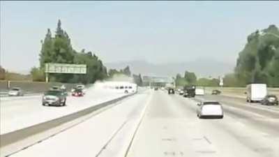 Bus crashes on freeway possibly as a result of another driver road raging