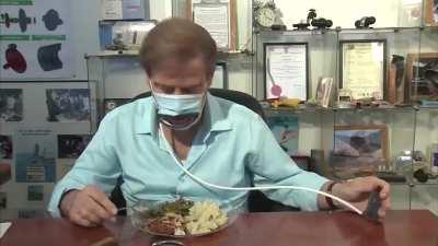 Inventors developed a coronavirus mask that lets you eat without taking it off. Squeeze a lever and it opens a slot so you can go at it like Pac-Man. Inventors say the mask lets you can dine out with friends without taking your mask off.  