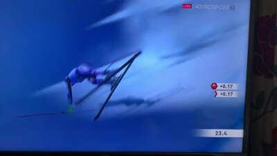 Skiier falls, bounces, stays upright