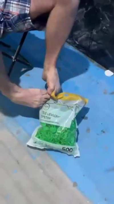 A man with no arms helps to remodel a bathroom 