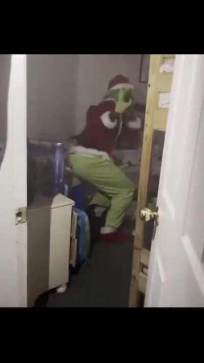 Dad tricks kids by dressing up as the grinch and stealing their presents.