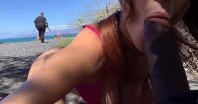 Naughty blowjob on public beach