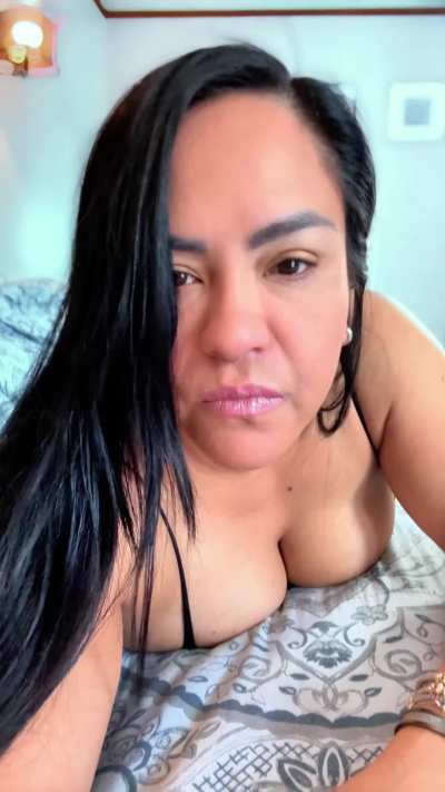 One big bed, one cute MILF, two hands necessary