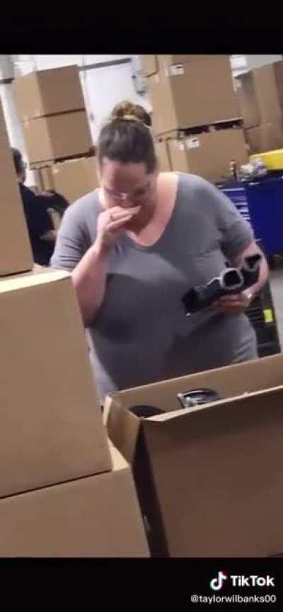 Worker appears to touch her own genitals, then smell her hands while working