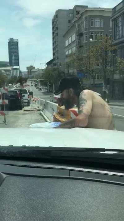 Cool guy keeping it super high and tight on the streets of SF. Definitely not being stingy with it either.