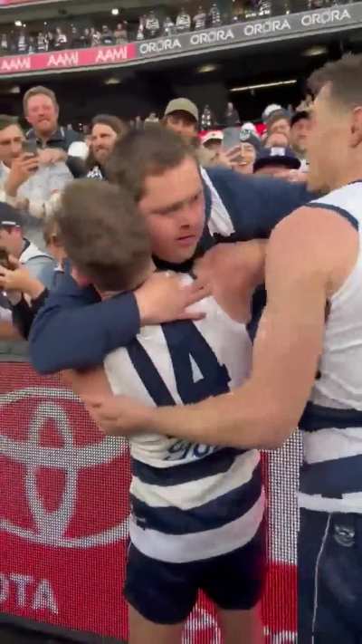 The Australian team calling their waterboy with Down syndrome to celebrate with them.