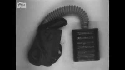 British soldiers displaying and donning various respirators circa 1918