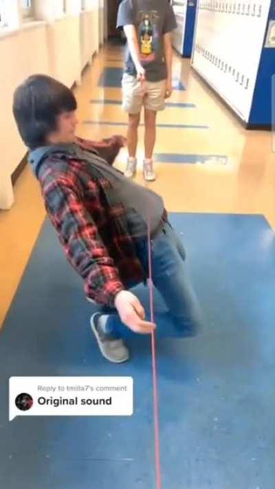WCGW trying to limbo in a hallway.