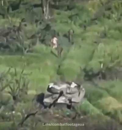 Russians flee from their hit tank naked.