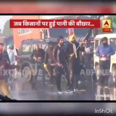 Single farmer taking on water cannons. Fire.emoji