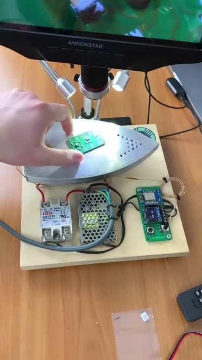 Filming the creation of a circuit board though a microscope