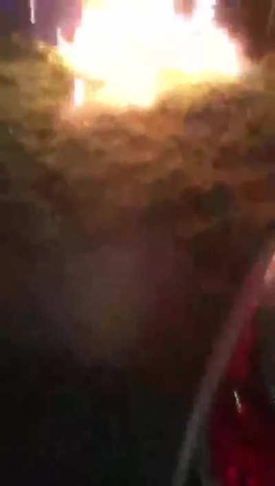 Pouring gasoline on bonfire