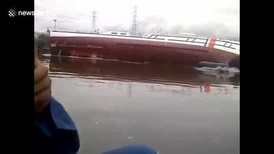 Disastrous moment brand new ship capsizes right after launch