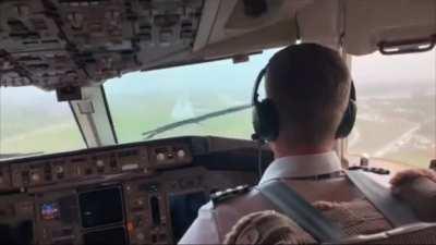 Pilots land in turbulent weather with low visibility and rain
