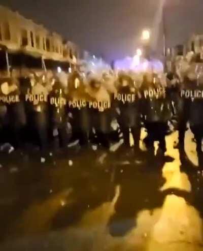 Philadelphia Police getting pelted by a crowd in response to the killing of Walter Wallace Jr.