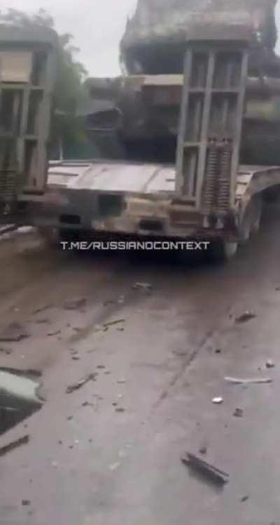 Car containing Russian soldiers was ran over by tank. One of the soldiers is still alive, but stuck under wreckage. NSFW
