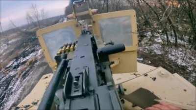 video showing a Ukrainian soldier from the 3rd separate assault brigade firing an M2 Browning at russian position near Bakhmut.