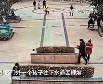 Dropping a firecracker near a manhole