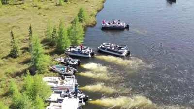 Small island moved by a bunch of private boats