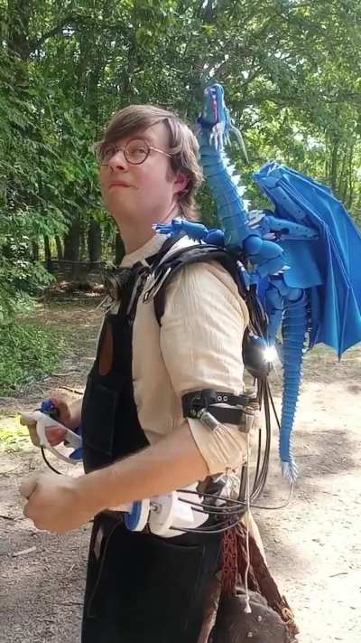 A guy creates a mechanical shoulder dragon to use for Renaissance cosplay