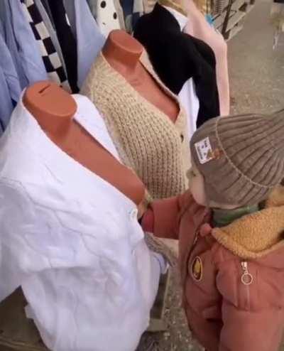 Kid learns early on that not all boobies are real.
