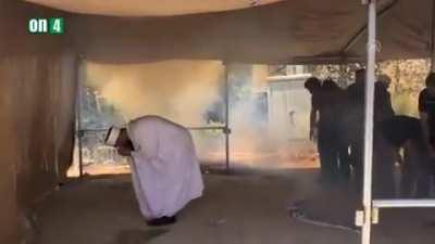 Israel military forces tear gas at Palestinian civilians while praying.