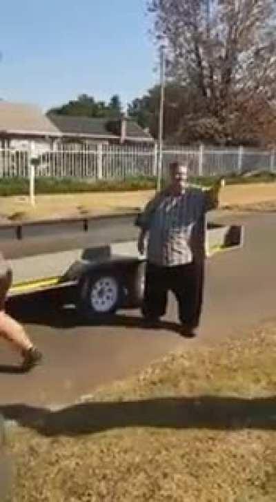 Man was about to attack the lady recording but her son steps in to protect her.