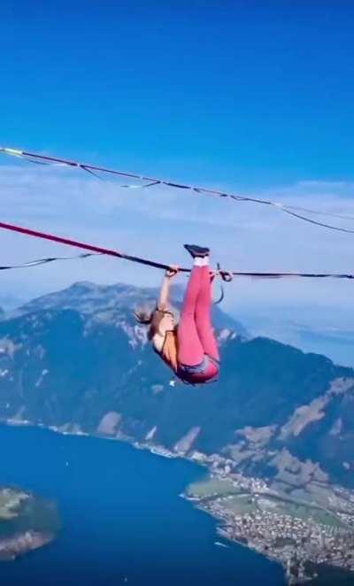Jumping on an elastic tight rope in the Alps