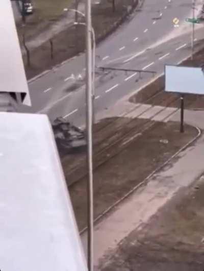 Russian tank running over a civilian vehicle.