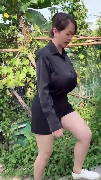 Unknown busty Asian in satin