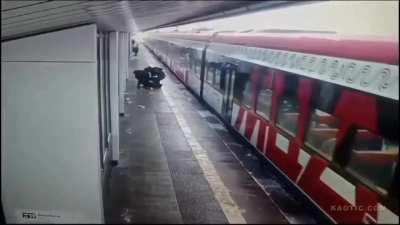 Boxing with friends on a railway platform