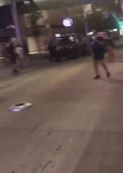 Protester follows police instructions to surrender their shield