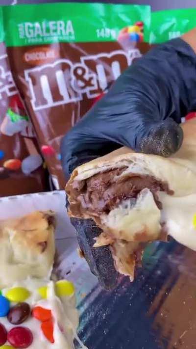 M&M pizza with chocolate crust filling from a pizzeria in Brazil.