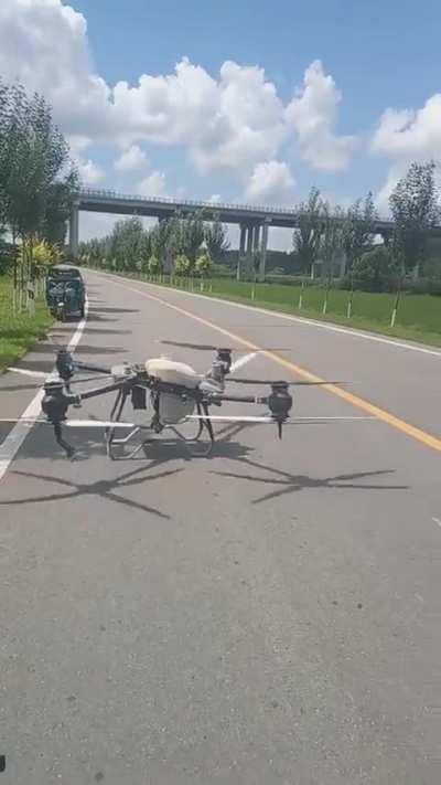 To fly a drone in the middle of the road
