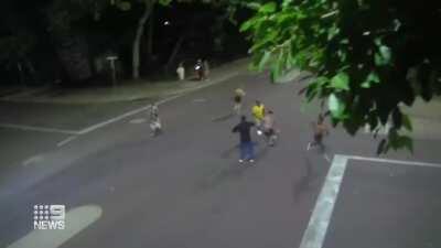 Man runs over his victim with a car and gets caught and beat when he can't get away.