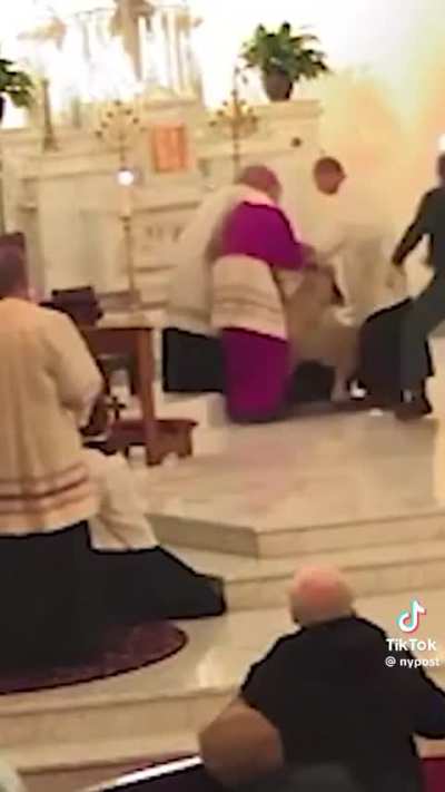 Guy punches priest