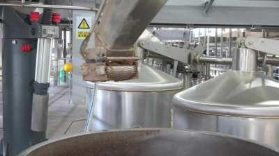 At a factory in central China's Wuhan City, robotic arms put a modern spin on the millennia-old tradition of distilling liquor.