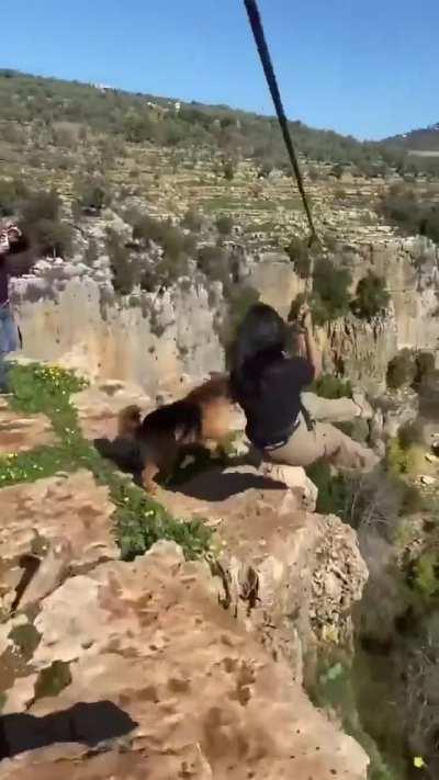 Jumping harnessed from a cliff with your dog.