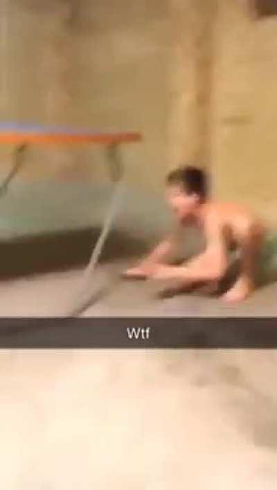 Kid throws ping pong paddle at his brother