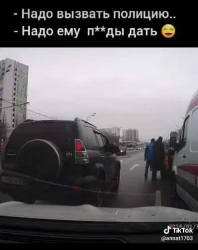 A taxi driver trying to stop an ambulance