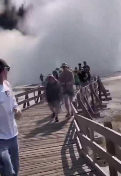BREAKING: 23 July 2024 - Biscuit Basin, Yellowstone National Park, Wyoming, USA - Geyser explosion. Tourist sent running